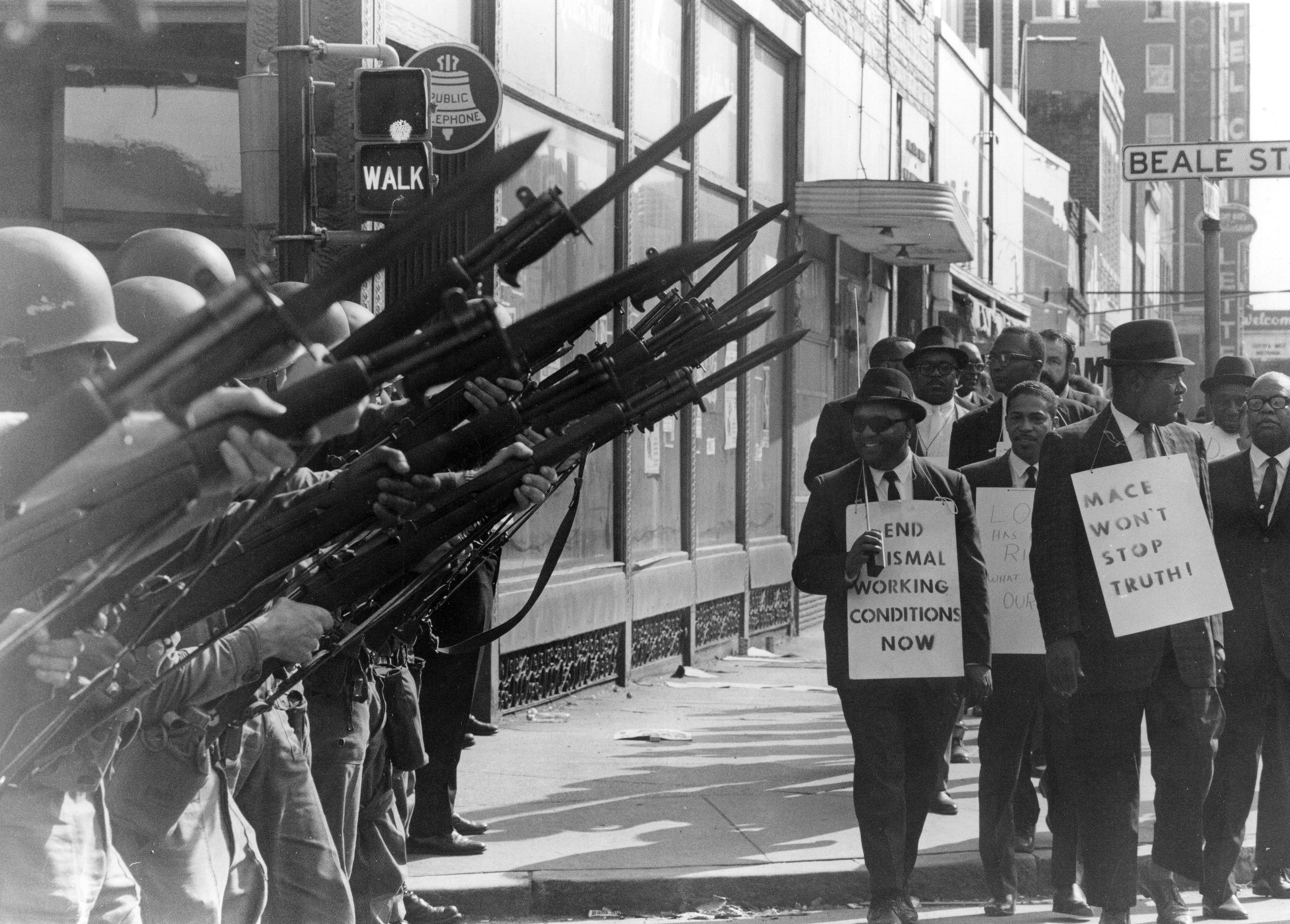 Sanitation workers strike on Beale Street, Memphis, 1968, with the National Guard.